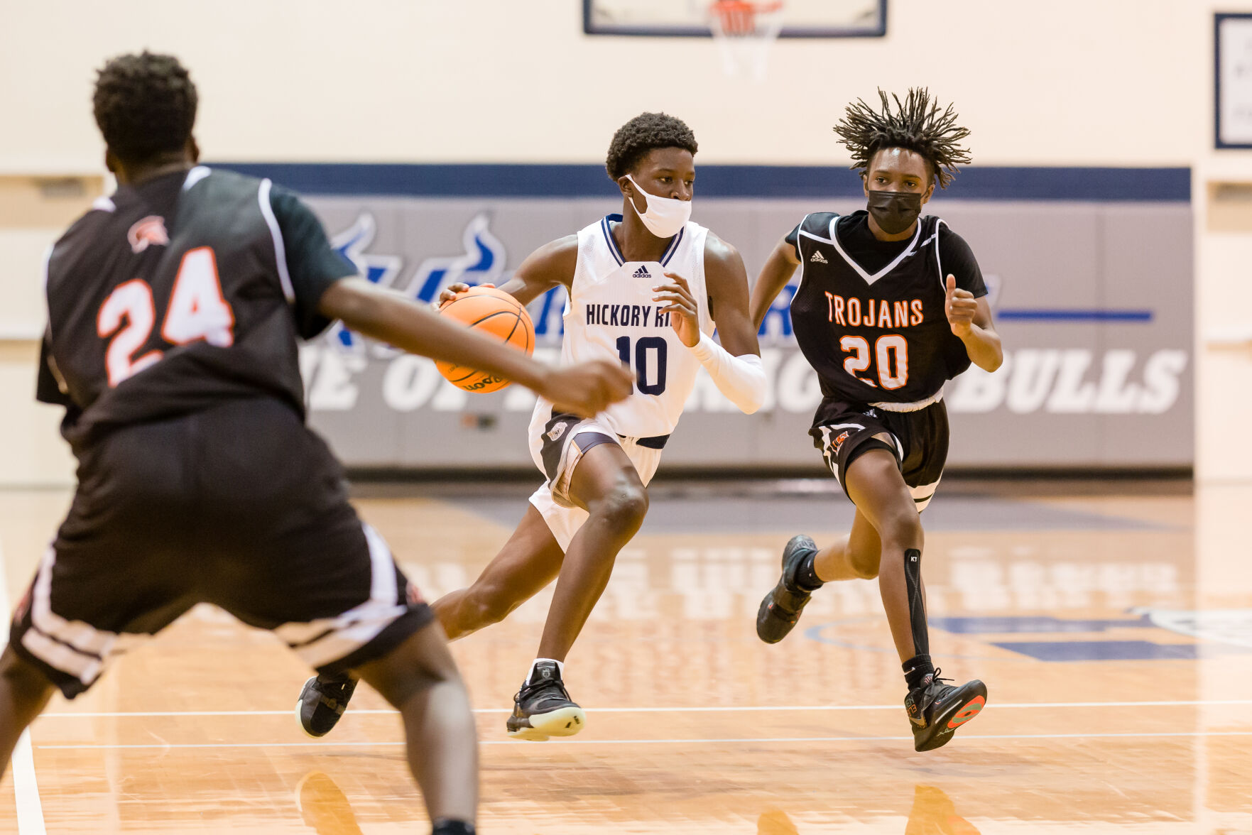 Boys Basketball: Hickory Ridge RaginÕ Bulls defeated the Northwest Cabarrus Trojans 64-56.